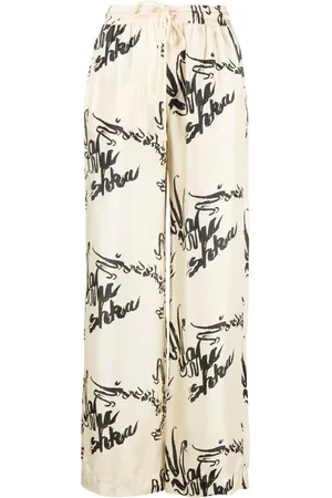 Nanushka Jarine calligraphy-print silk trousers