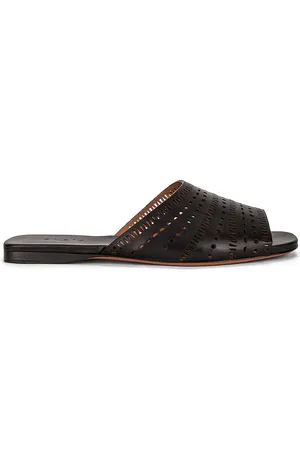 Alaïa Vienne Leather Slides in Noir - Black. Size 36 (also in 36.5, 37.5).