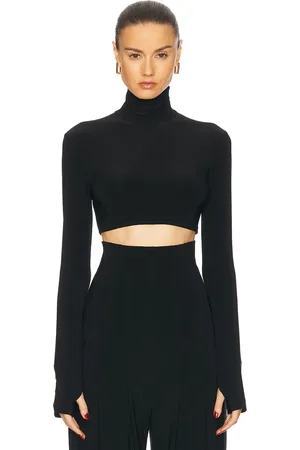 Norma Kamali Cropped Slim Fit Long Sleeve Turtleneck Top in Black - Black. Size L (also in XL).