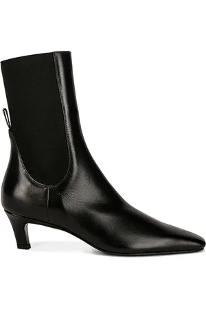 Totême The Mid Heel Boot in Black - Black. Size 37 (also in ).
