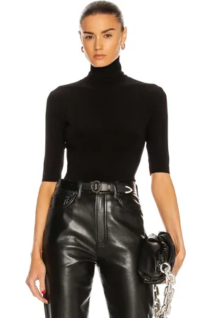 Norma Kamali Slim Fit Short Sleeve Turtleneck Top in Black - Black. Size L (also in M, S, XL, XS).