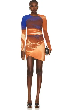 Simkhai Abby Long Sleeve Ruched Mini Dress in Sierra Print - Rust. Size XS (also in ).