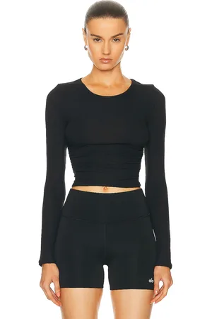 alo Gather Long Sleeve Top in Black - Black. Size S (also in XS).