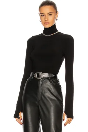 Norma Kamali Slim Fit Long Sleeve Turtleneck Top in Black - Black. Size S (also in XS).