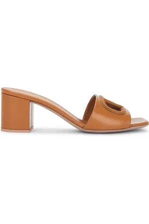 VALENTINO GARAVANI V Logo Cut Out Mule in Almond Beige & Antique Brass - Beige. Size 36.5 (also in 37, 37.5, 39, 39.5, 40, 41).