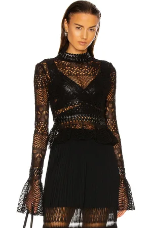 Alaïa Fitted Long Sleeve Top in Noir - Black. Size 40 (also in ).