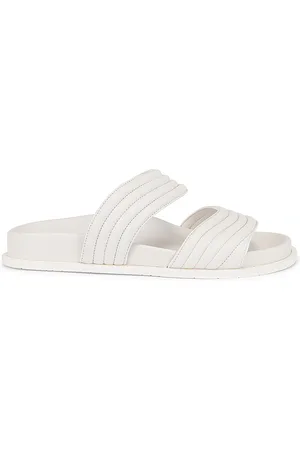 Alaïa Leather Slides in Blanc Casse - White. Size 36 (also in 37, 40).