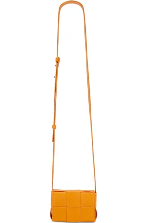 Bottega Veneta Candy Cassette Crossbody Bag in Tangerine & Gold - Tangerine. Size all.