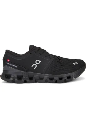 On Running Cloud X 4 Sneaker in Black & Eclipse - Black. Size 5 (also in 5.5, 6).