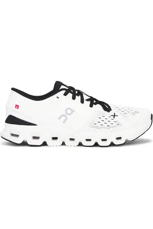 On Running Cloud X 4 Sneaker in Ivory & Black - Ivory. Size 5 (also in 5.5, 7, 8.5, 9, 9.5).