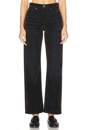 RE/DONE 90s High Rise Loose in Brown Flocked - Brown. Size 25 (also in 26, 27, 28, 29, 30, 31, 32).