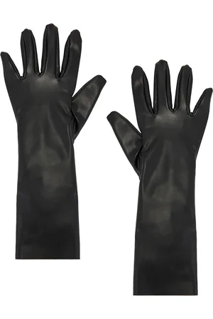 Norma Kamali Short Gloves in Black - Black. Size M-L (also in ).