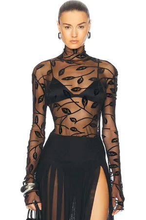 Norma Kamali Long Sleeve Turtleneck Top in Black Leaf - Black. Size L (also in M, S, XS).