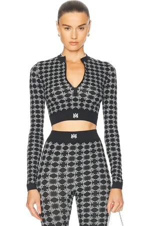 AMIRI Quad Seamless Half Zip Top in Black - Black. Size XS/S (also in ).
