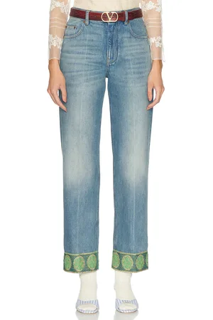 VALENTINO Straight Leg Jean in Medium Blue - Blue. Size 25 (also in 26, 28).