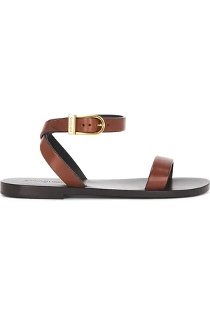 Saint Laurent Buckle Flat Sandal in Bruciato - Brown. Size 36 (also in 36.5, 37, 37.5, 38, 38.5, 39, 39.5, 40, 41).