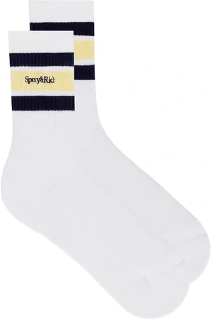 Sporty & Rich Serif Logo Socks in White - White. Size all.