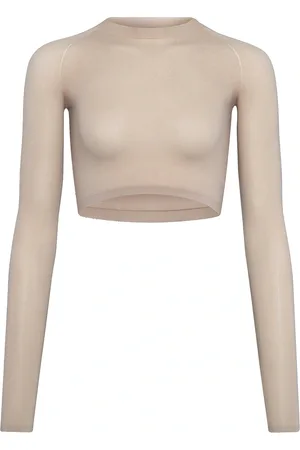Alaïa Long Sleeve Crop Top in Mastic - Beige. Size 34 (also in ).