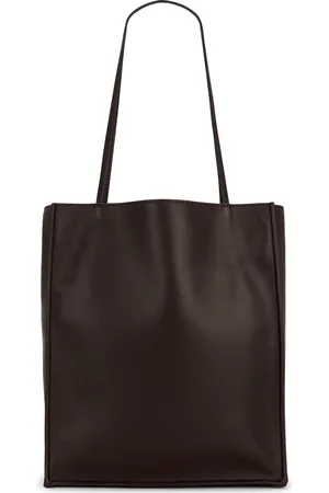 The Row Large To Go Tote Bag in Dark Brown ANS - Chocolate. Size all.