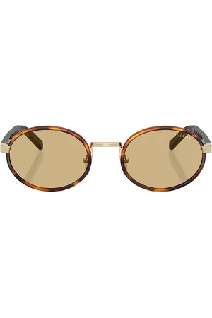 Prada Round Sunglasses in Root Tortoise - Brown. Size all.