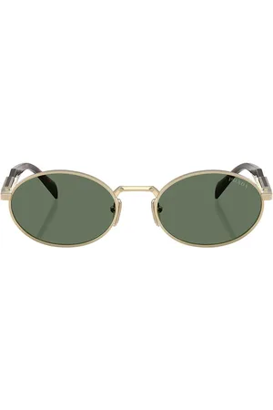 Prada Oval Sunglasses in Pale Gold - Metallic Gold. Size all.