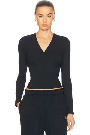 alo Ribbed Mesmerize Long Sleeve Top in Black - Black. Size XS (also in ).