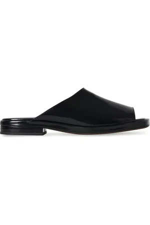 The Row Emi Mule Sandal in Black - Black. Size 36.5 (also in 37, 37.5, 39.5).