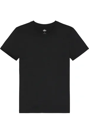 alo Conquer Reform Crewneck Short Sleeve T-shirt in Black - Black. Size L (also in M, S, XL/1X).