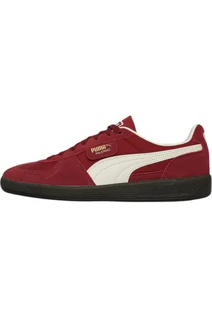 PUMA And White Trainers with Black Sole