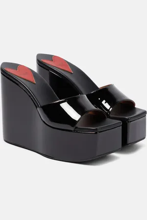 Alaïa AlaÃ¯a Patent leather platform wedge mules