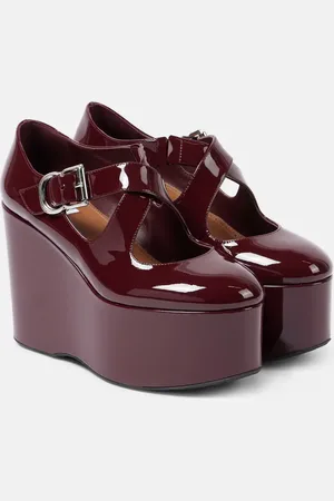 Alaïa AlaÃ¯a Criss Cross patent leather wedges