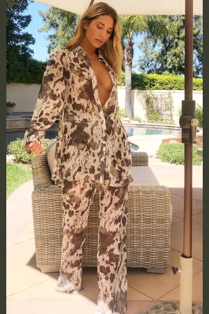 PRETTYLITTLETHING Cow Print Beach Flares