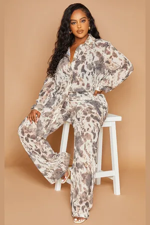 PRETTYLITTLETHING Plus Cow Print Beach Flares