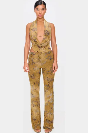 PRETTYLITTLETHING Olive Floral Print Devore Slim Flare Trousers