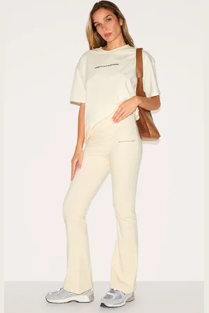 PRETTYLITTLETHING Beige Printed Flared Trousers