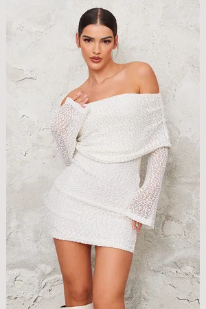 PRETTYLITTLETHING Cream Textured Bardot Flare Long Sleeve Mini Dress