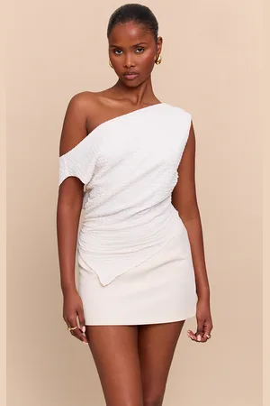 PRETTYLITTLETHING Cream Textured Slouchy Dip Hem Off Shoulder Top